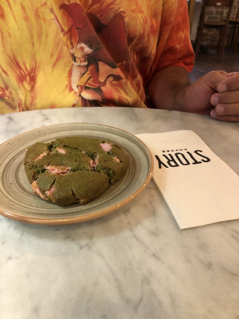 Sitting at Story Cafe in Moda with cookie
